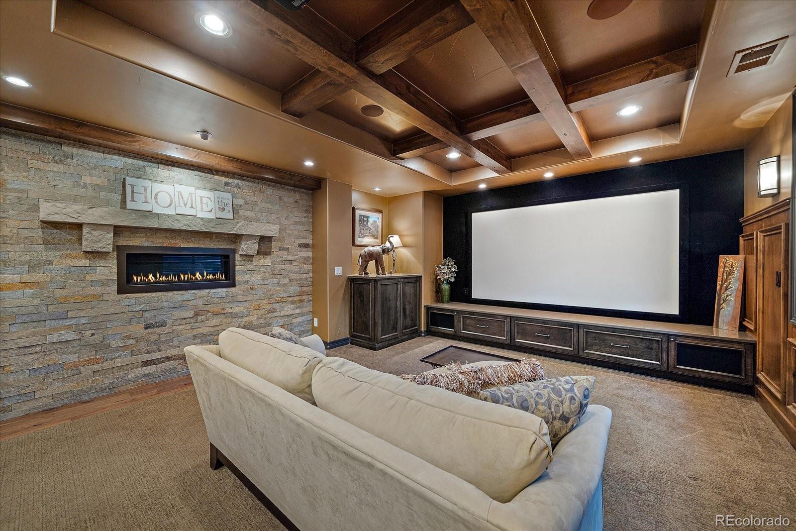 20132 East Shady Ridge Road Parker, CO 80134 - Photo 24 of 36 a living room with furniture and a flat screen tv