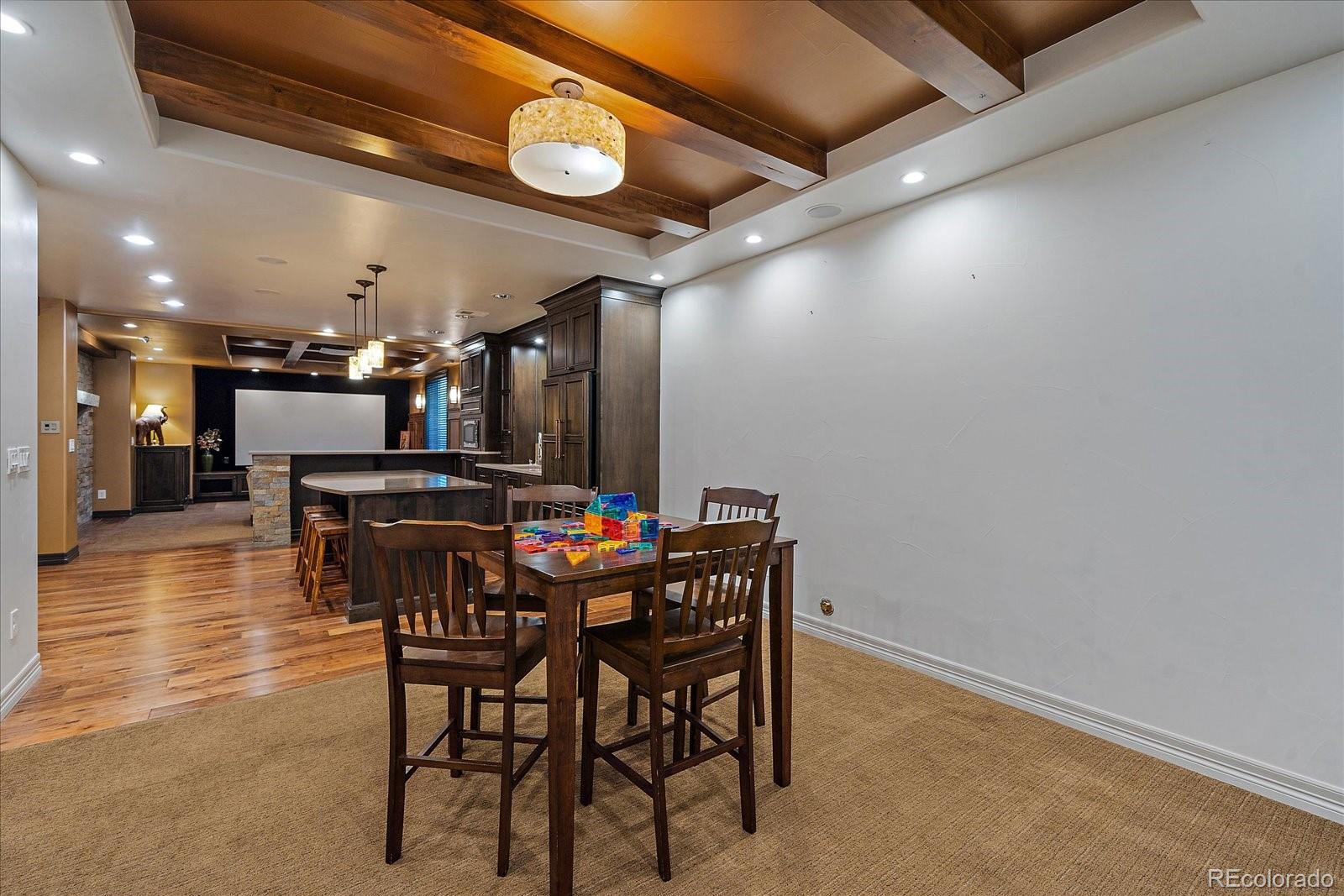 20132 East Shady Ridge Road Parker, CO 80134 - Photo 26 of 36 a view of a dining room with furniture