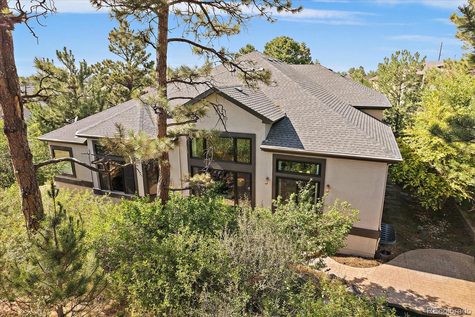 20132 East Shady Ridge Road Parker, CO 80134 - Photo 29 of 36 a aerial view of a house with a yard and potted plants