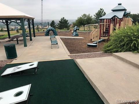 20132 East Shady Ridge Road Parker, CO 80134 - Photo 36 of 36 a view of a swimming pool with a patio
