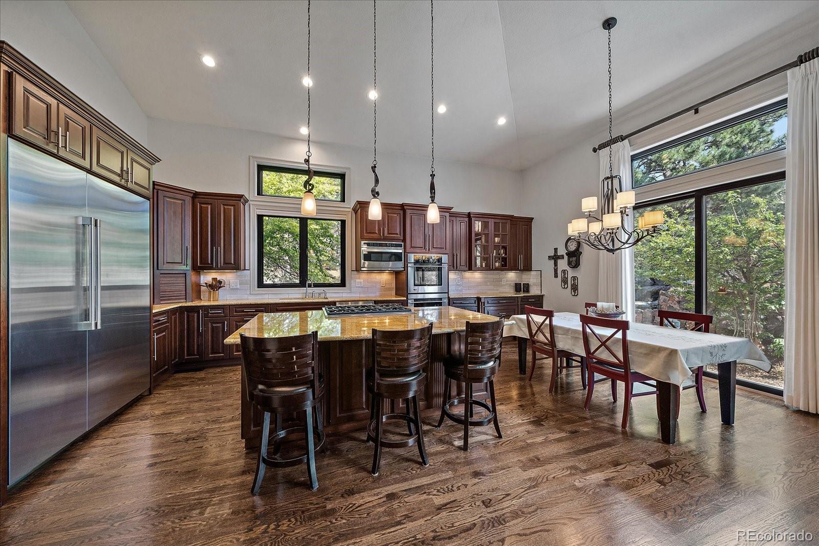 20132 East Shady Ridge Road Parker, CO 80134 - Photo 9 of 36 a view of a dining room with furniture window and wooden floor