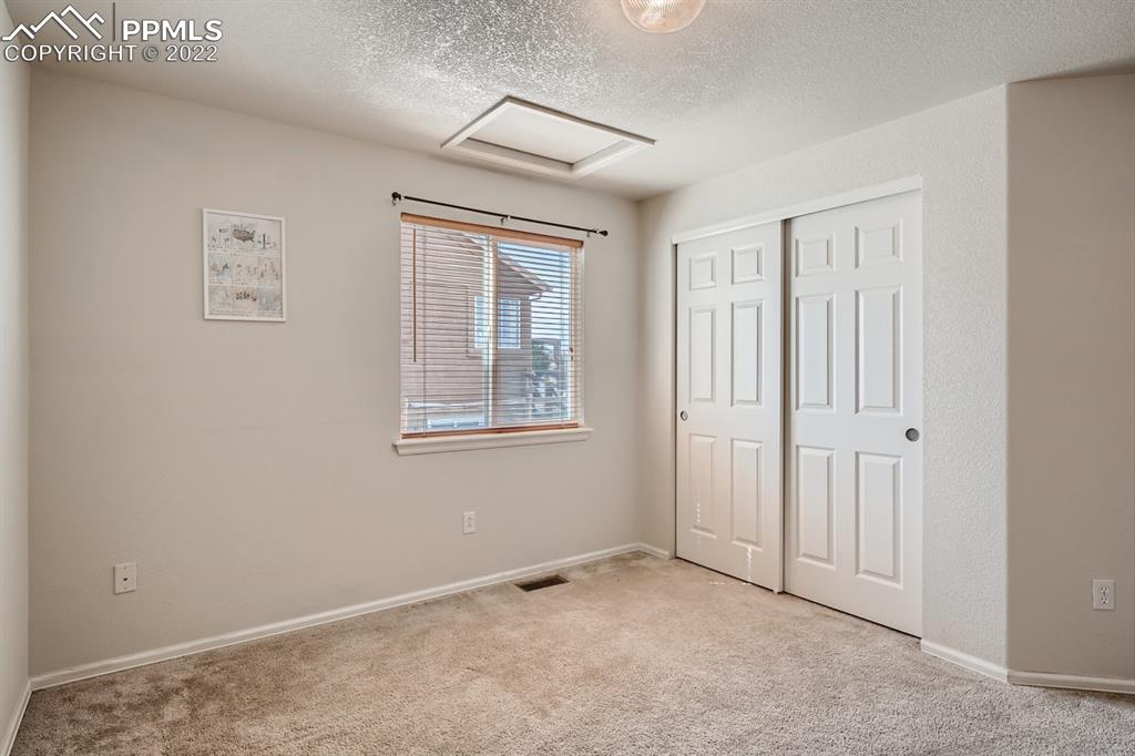 12118 Rio Secco Road Peyton, CO 80831 - Photo 14 of 23 a view of an empty room with a window
