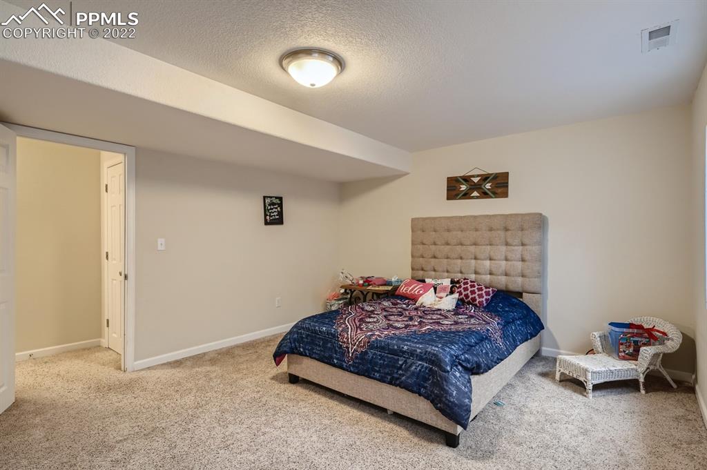 12118 Rio Secco Road Peyton, CO 80831 - Photo 19 of 23 a living room with furniture