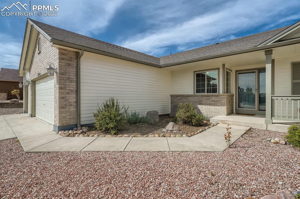 12118 Rio Secco Road Peyton, CO 80831 - Photo 2 of 23 a view of a house with a backyard