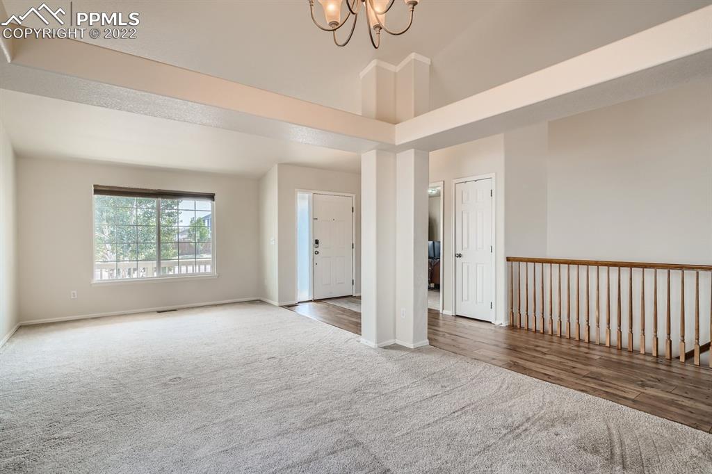 12118 Rio Secco Road Peyton, CO 80831 - Photo 5 of 23 a view of empty room with windows