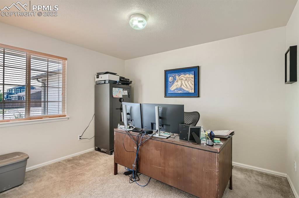 12118 Rio Secco Road Peyton, CO 80831 - Photo 6 of 23 a living room with furniture and a window