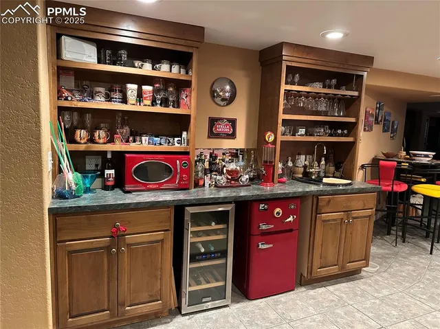 a kitchen with stainless steel appliances granite countertop a stove and cabinets