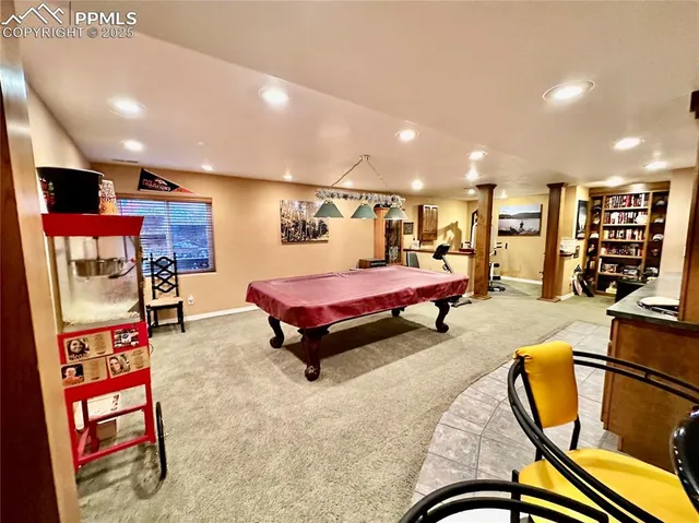 a living room with furniture gym equipment and view of living room