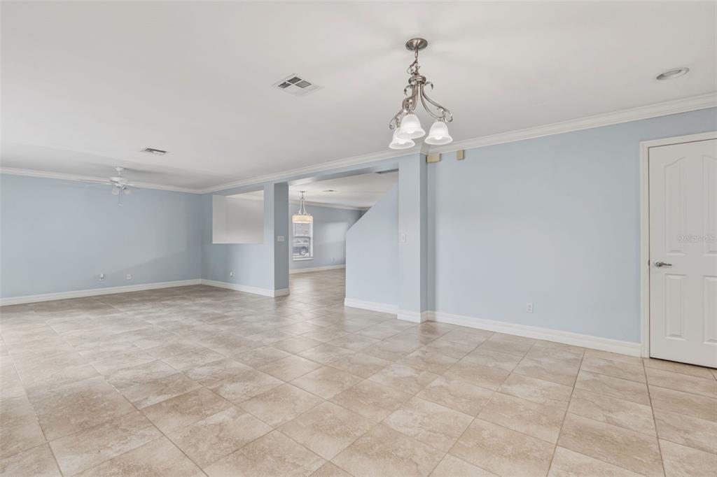 25134 Palisade Road Punta Gorda, FL 33983 - Photo 20 of 58 a view of a chandelier in an empty room