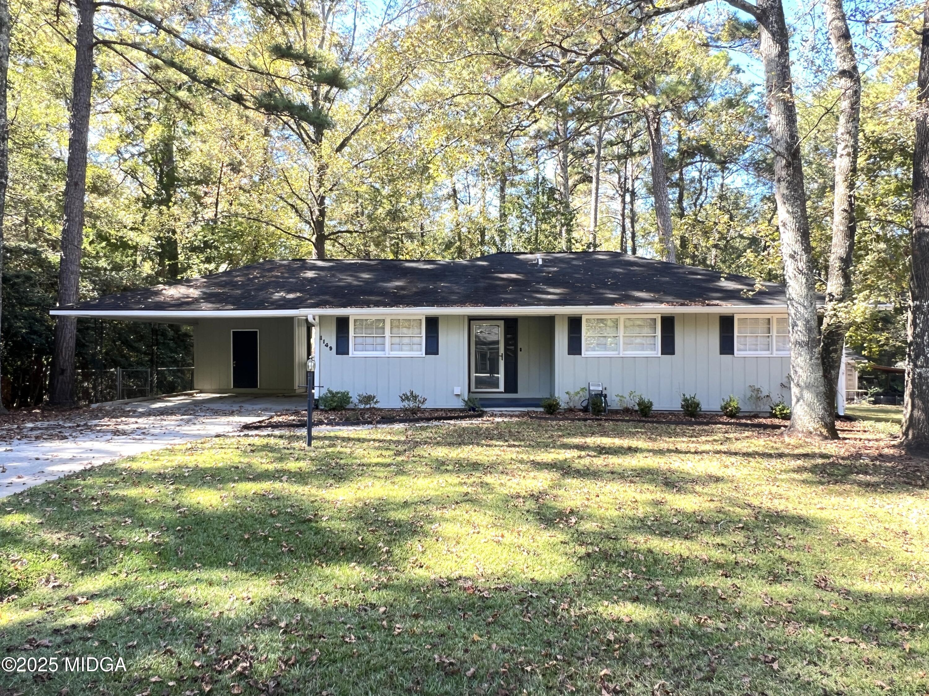 1149 Runnymede Lane Macon, GA 31220 - Photo 1 of 25 a view of a house with swimming pool and a yard