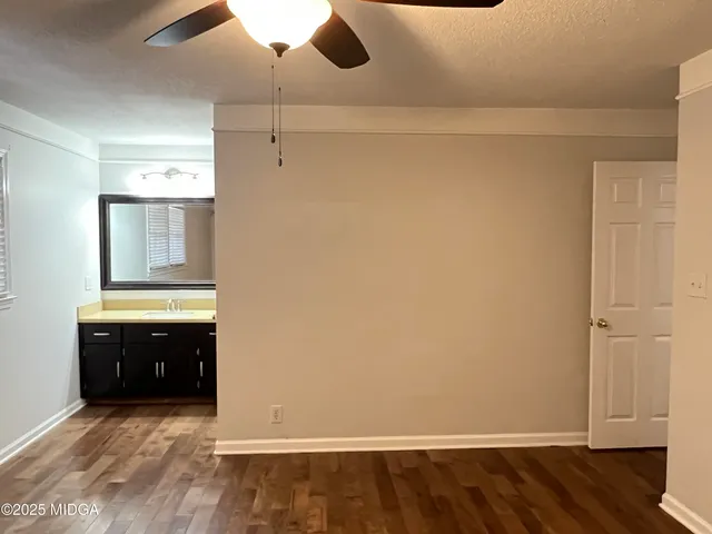 wooden floor and cabinet in an empty room