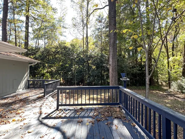 a view of balcony with wooden floor and outdoor space