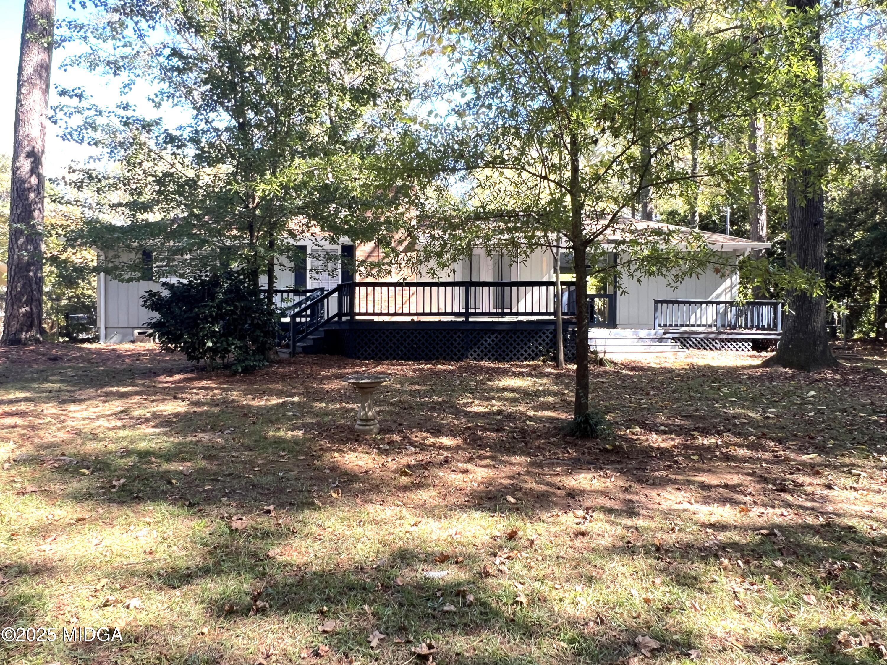 1149 Runnymede Lane Macon, GA 31220 - Photo 24 of 25 a view of a yard with plants and trees