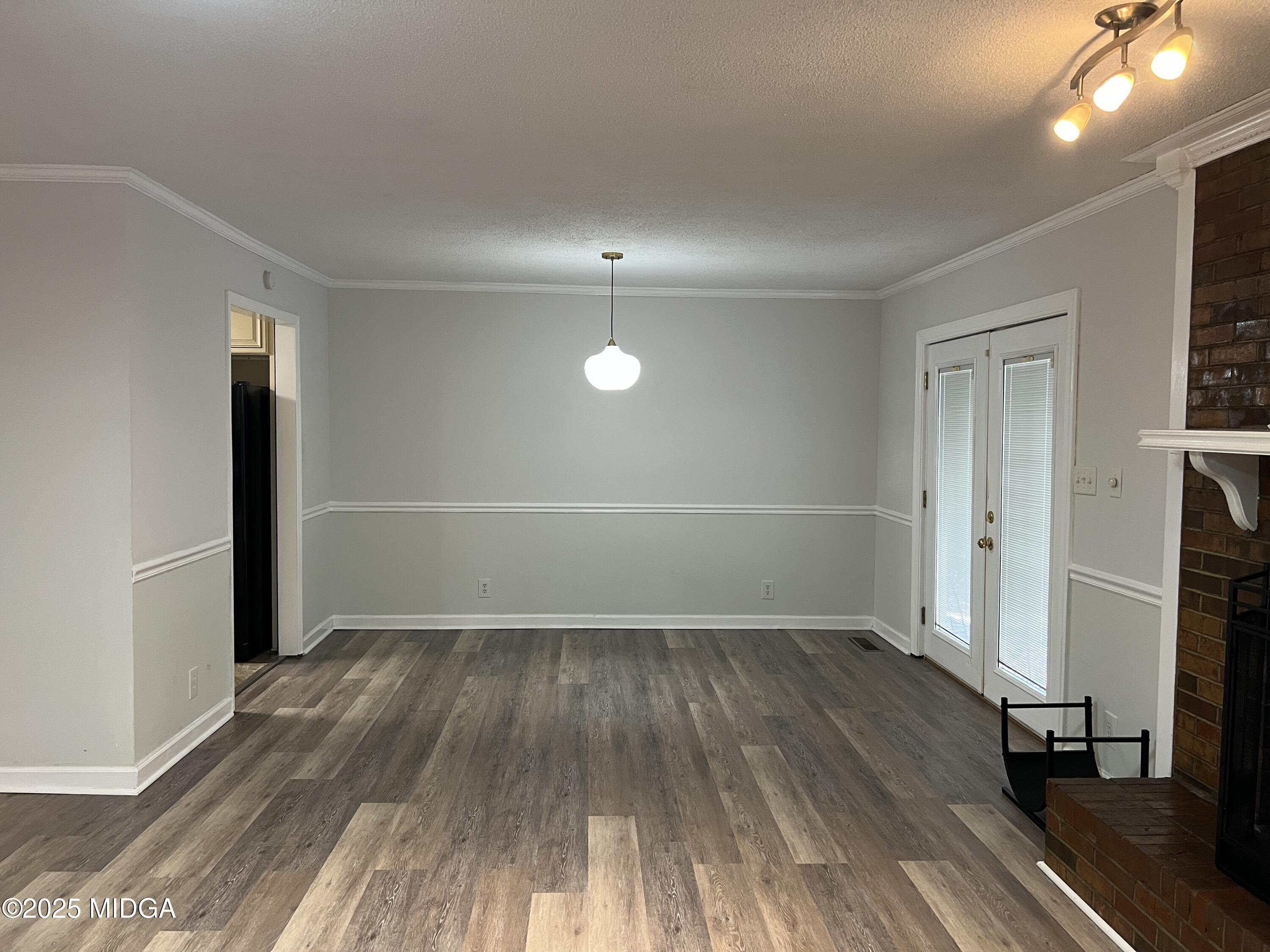 1149 Runnymede Lane Macon, GA 31220 - Photo 3 of 25 wooden floor in an empty room with a window