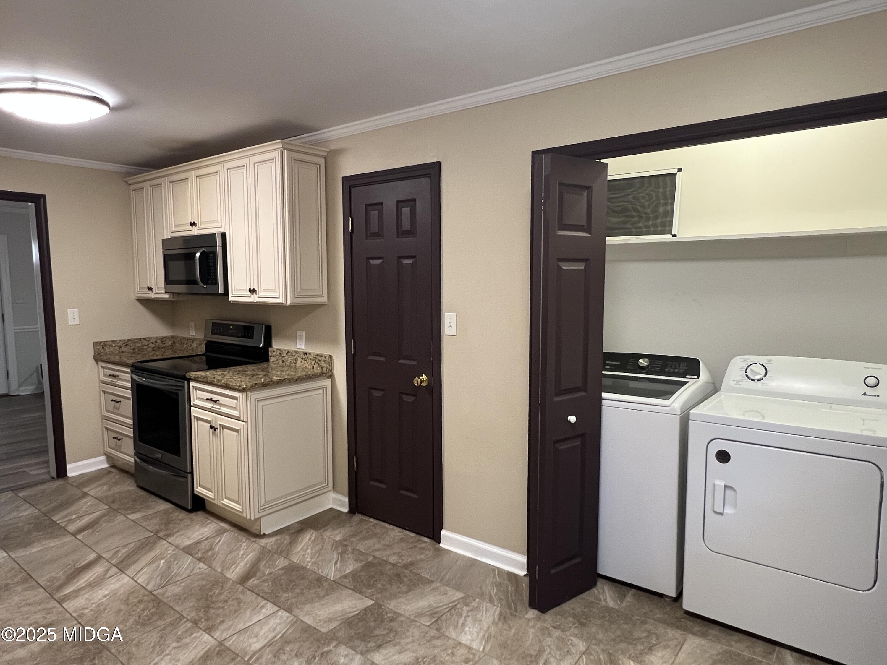 1149 Runnymede Lane Macon, GA 31220 - Photo 7 of 25 a kitchen with a stove and a refrigerator