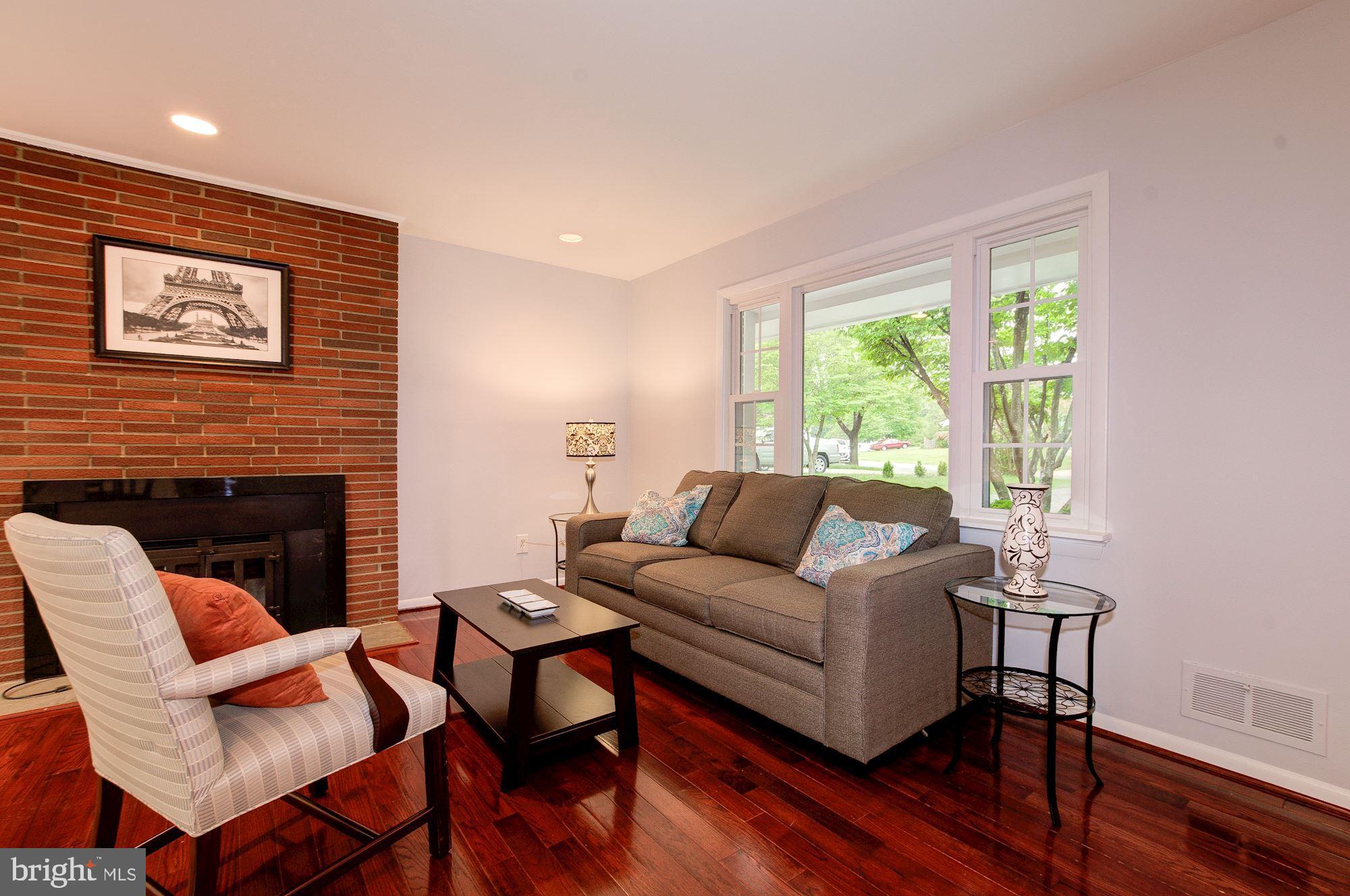 12825 Jingle Lane Silver Spring, MD 20906 - Photo 4 of 29 Living room w/ hardwood floors and nice brick FP!