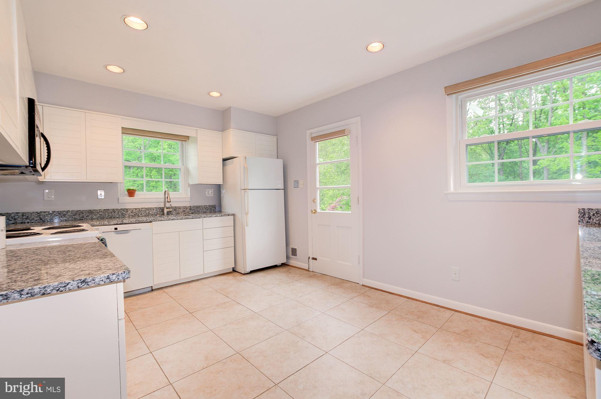 12825 Jingle Lane Silver Spring, MD 20906 - Photo 9 of 29 Kitchen connects to deck for easy entertaining!