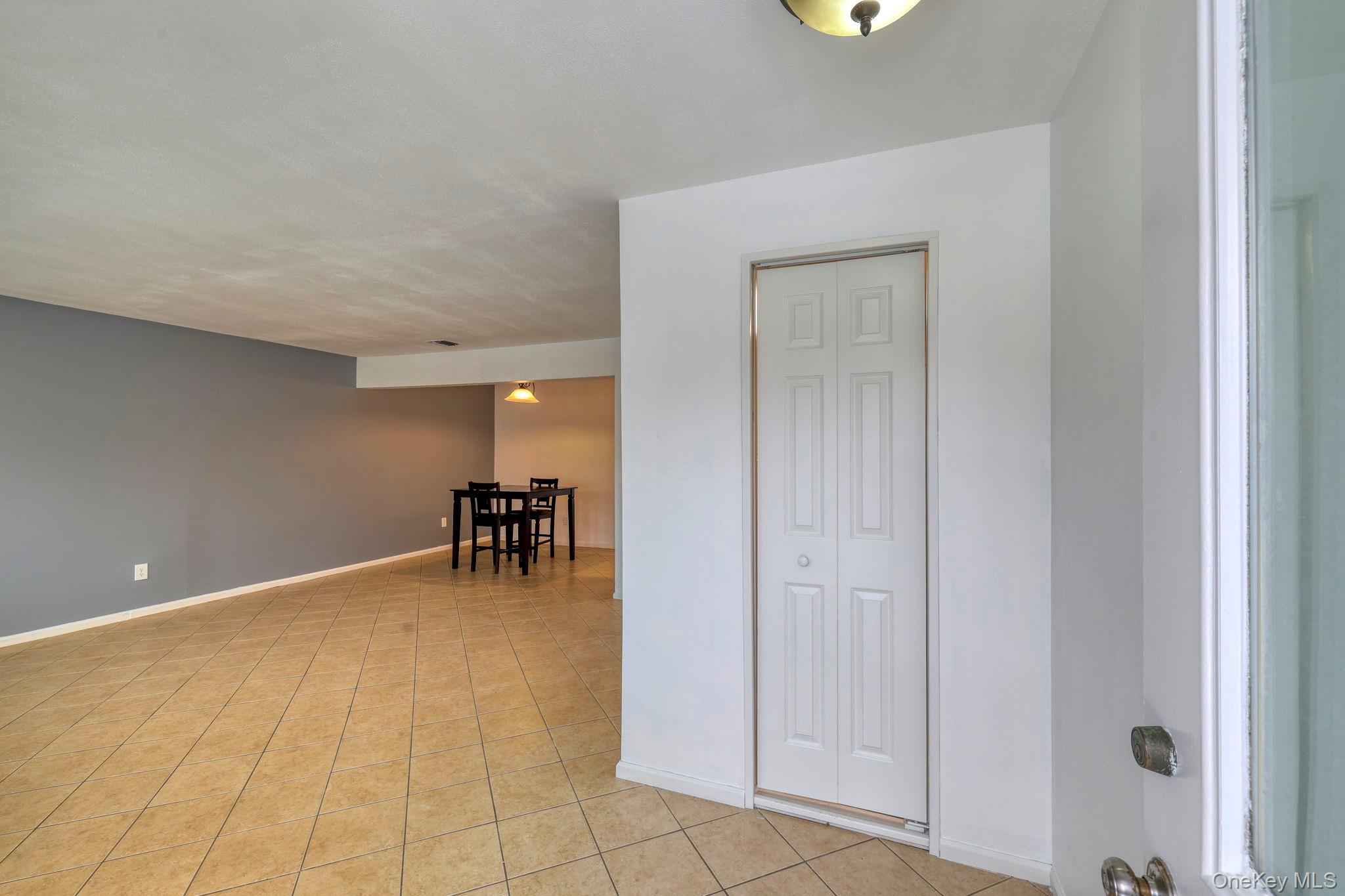 276 Temple Hill Road, Unit 2513 New Windsor, NY 12553 - Photo 12 of 15 a view of livingroom with a table and chairs