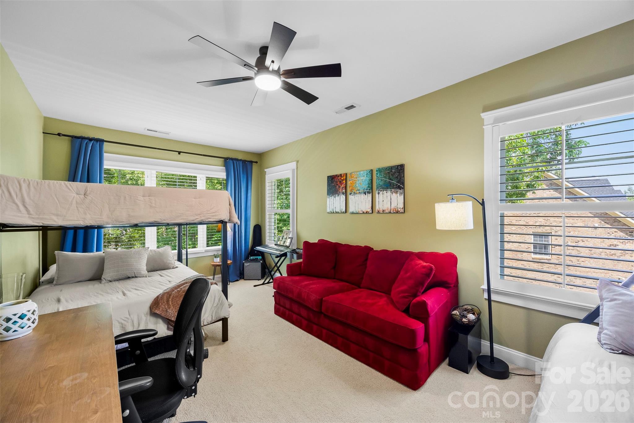 606 Andover Lane Tega Cay, SC 29708 - Photo 28 of 48 a living room with furniture a ceiling fan and a window