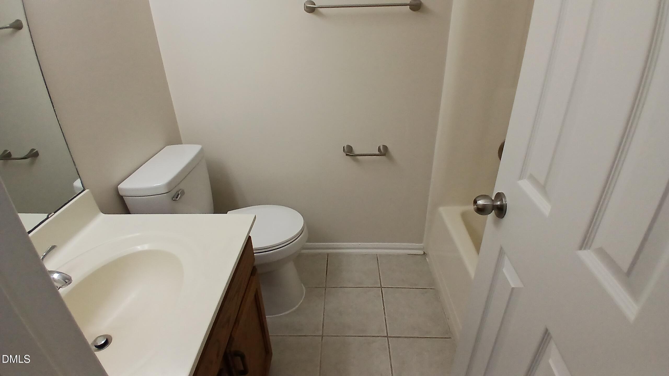 2224 Bufflehead Road Raleigh, NC 27616 - Photo 14 of 33 a bathroom with a sink and toilet