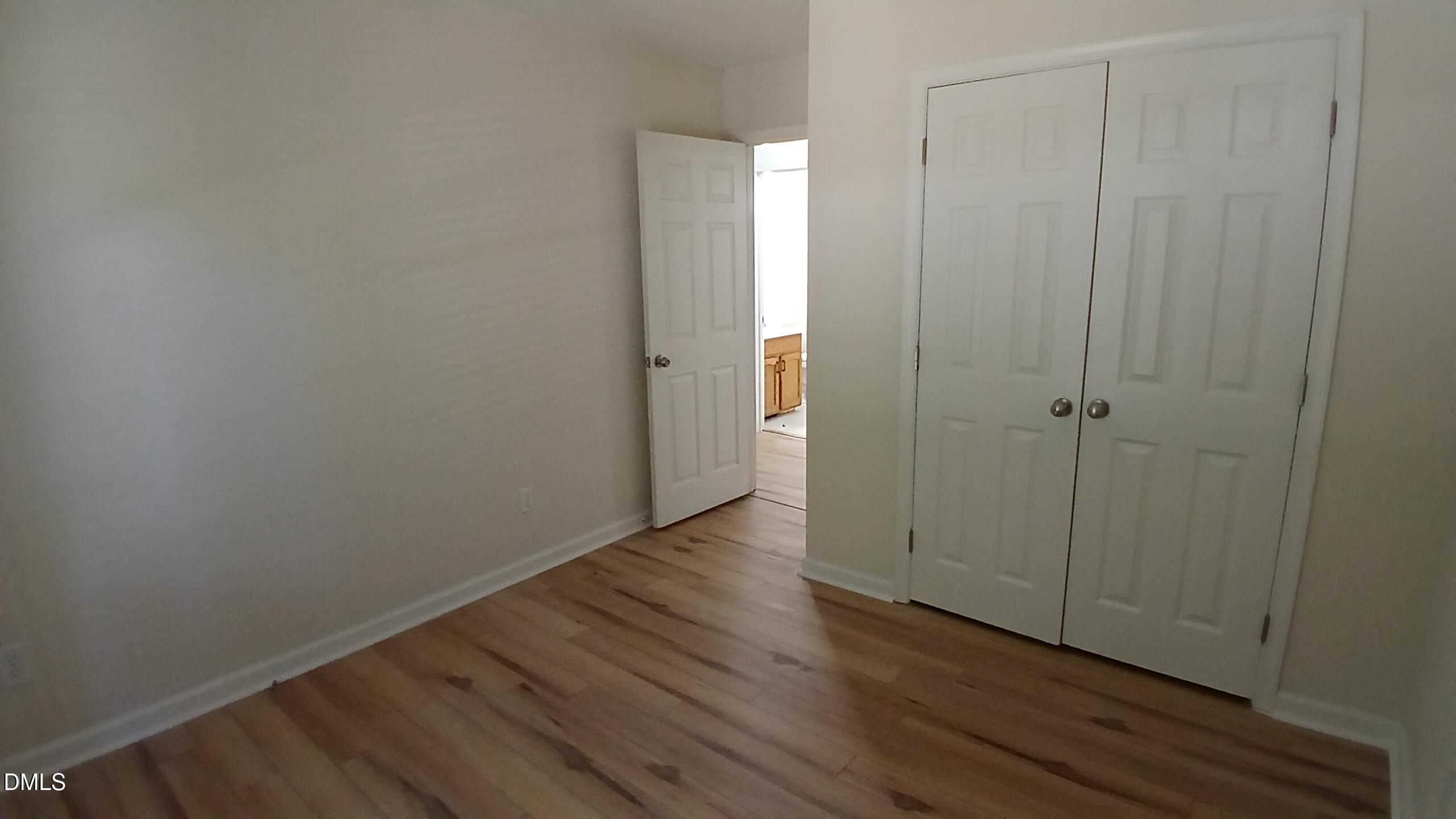 2224 Bufflehead Road Raleigh, NC 27616 - Photo 16 of 33 a view of an empty room with wooden floor