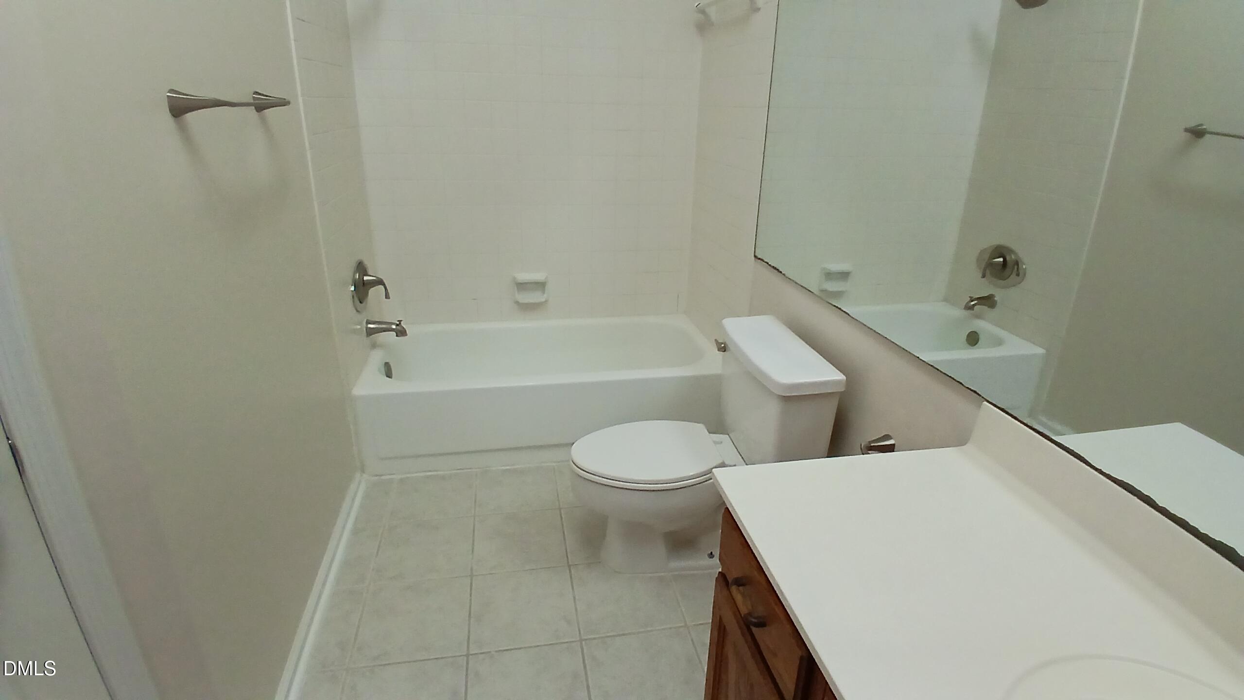 2224 Bufflehead Road Raleigh, NC 27616 - Photo 20 of 33 a bathroom with a toilet and a bath tub
