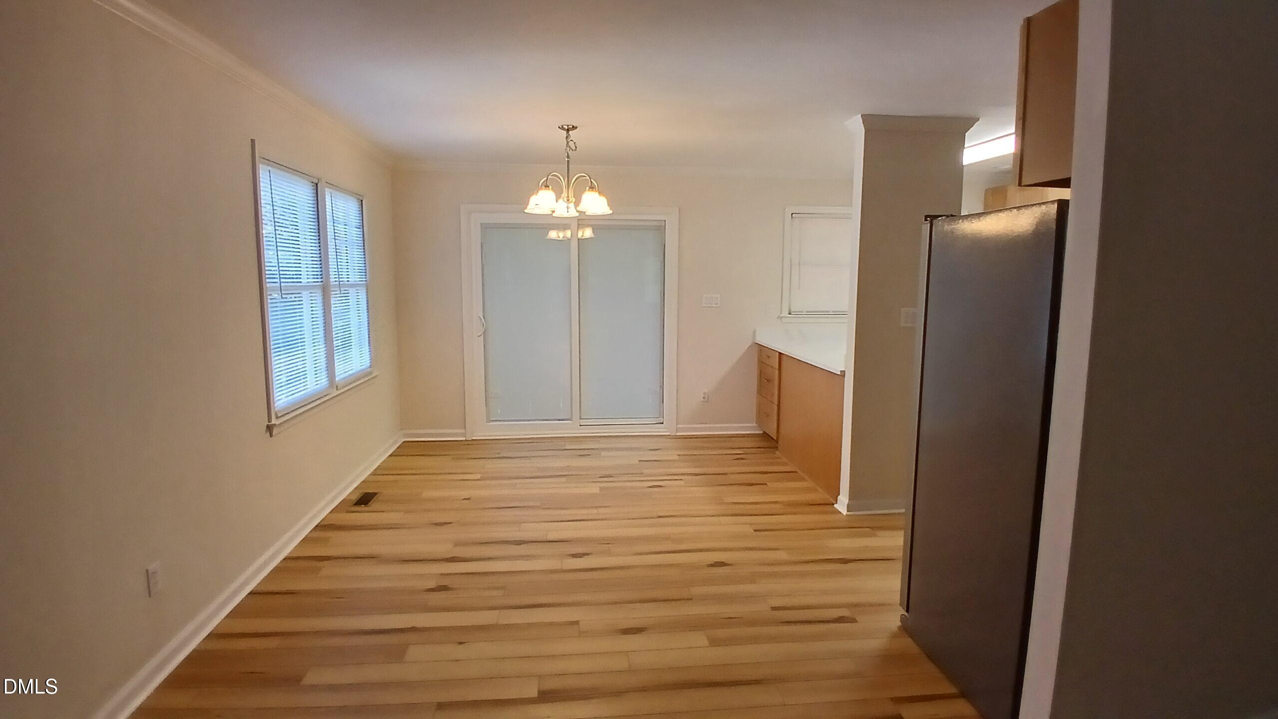 2224 Bufflehead Road Raleigh, NC 27616 - Photo 6 of 33 a view of empty room with wooden floor