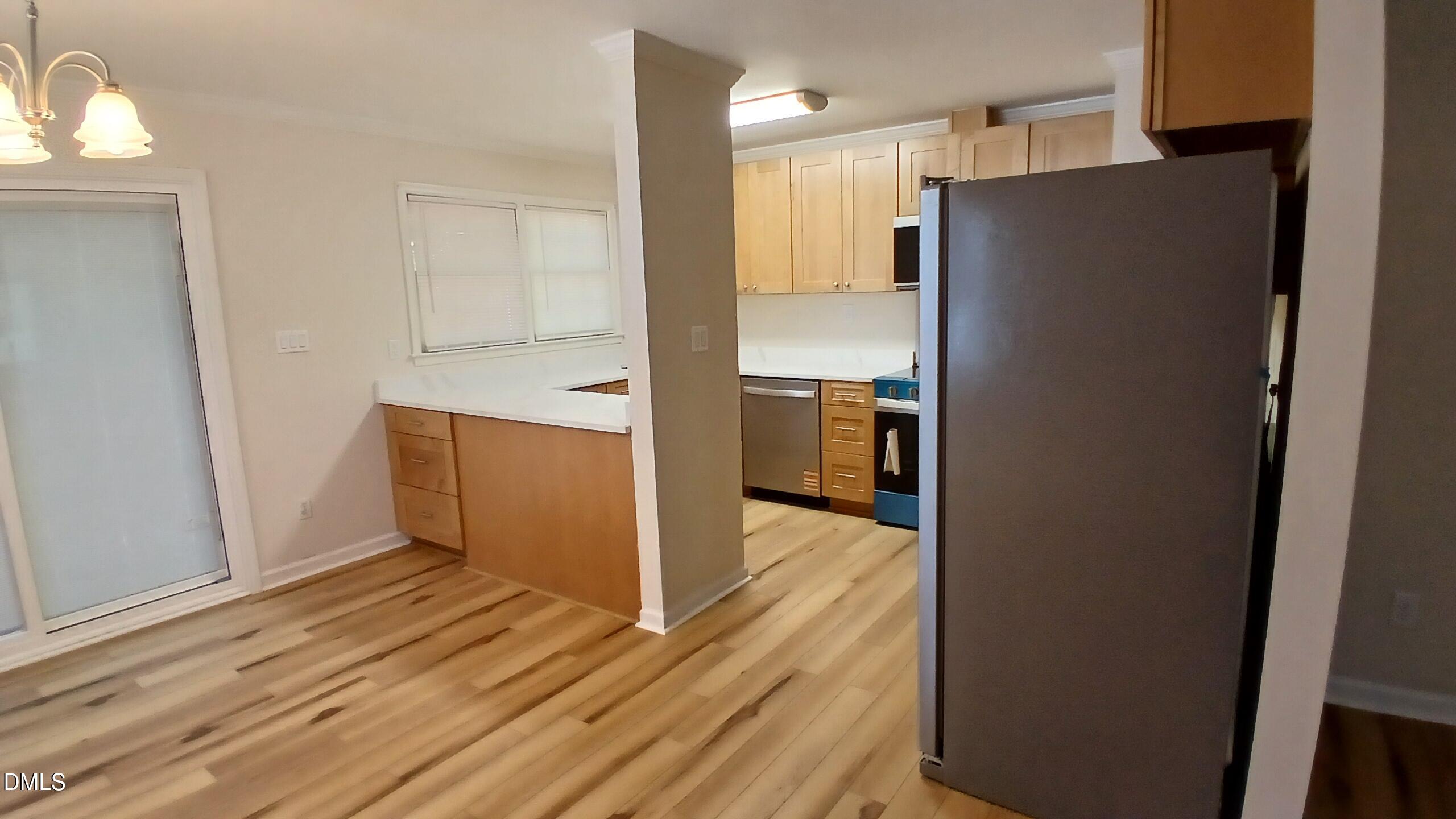 2224 Bufflehead Road Raleigh, NC 27616 - Photo 7 of 33 a view of a kitchen from the hallway