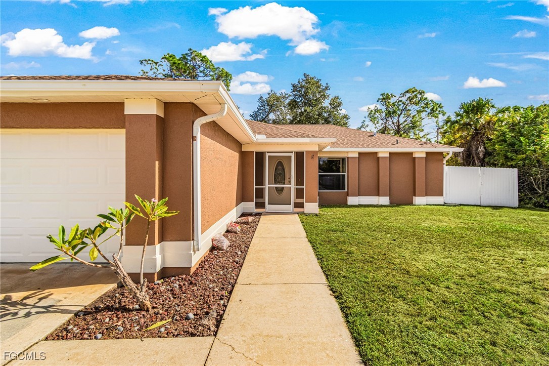 1644 Dawnview Street North Port, FL 34288 - Photo 25 of 32 a view of a house with a yard