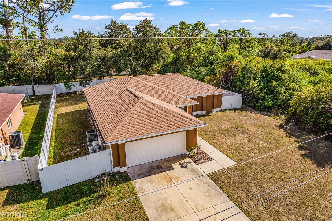1644 Dawnview Street North Port, FL 34288 - Photo 28 of 32 an aerial view of a house with swimming pool and large trees