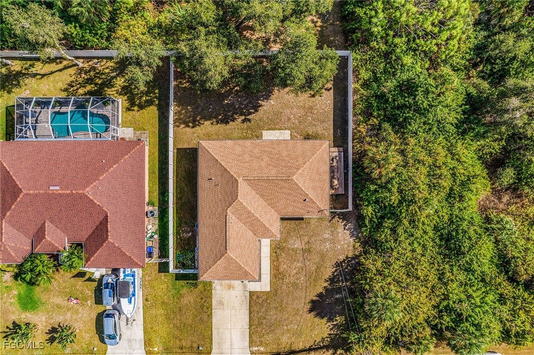 1644 Dawnview Street North Port, FL 34288 - Photo 29 of 32 an aerial view of residential houses with outdoor space and trees
