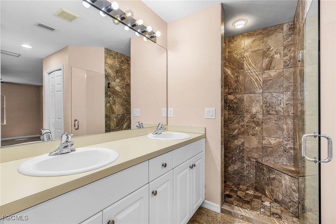 1644 Dawnview Street North Port, FL 34288 - Photo 5 of 32 a bathroom with a sink and a mirror