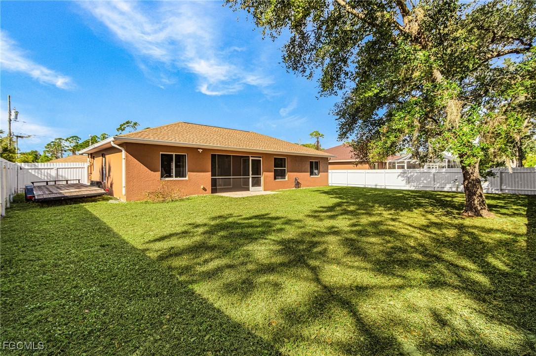 1644 Dawnview Street North Port, FL 34288 - Photo 6 of 32 a view of a house with a backyard