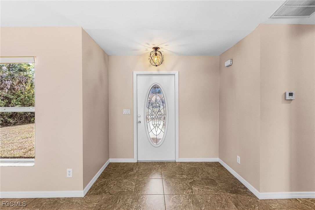 1644 Dawnview Street North Port, FL 34288 - Photo 9 of 32 a view of an entryway with wooden floor