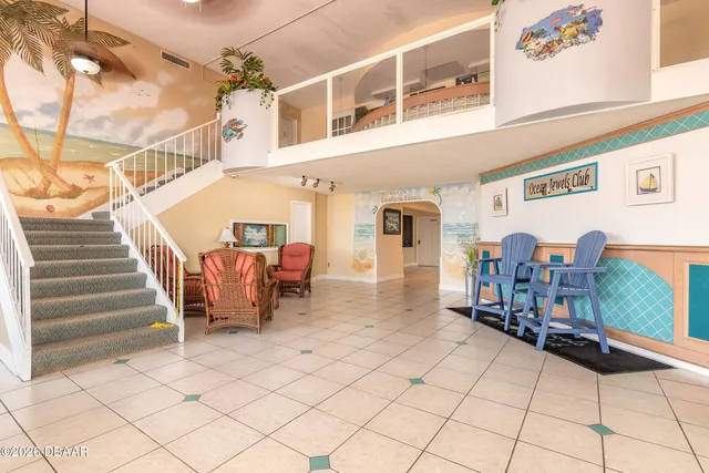 a swimming pool view with a seating space