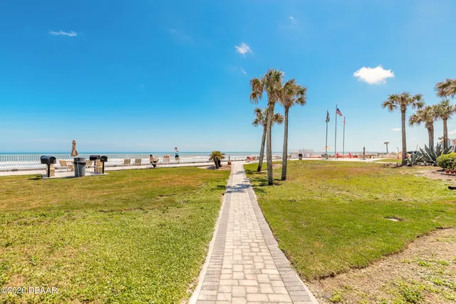 an aerial view of a house with a swimming pool