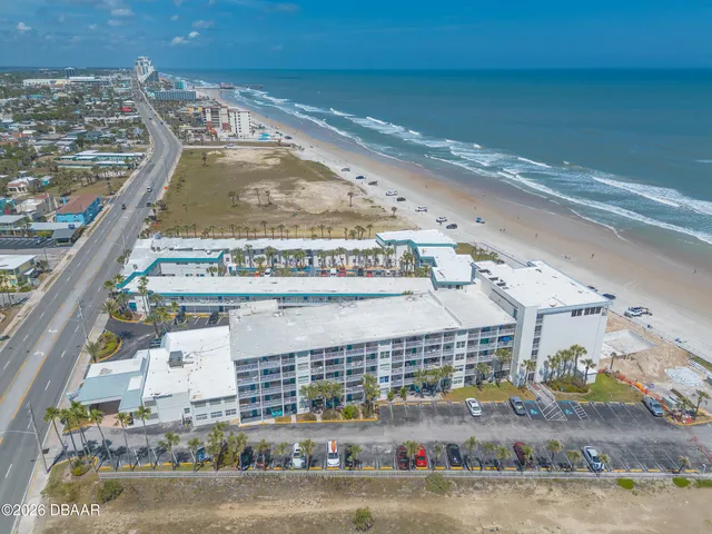 an aerial view of a house with a lake view