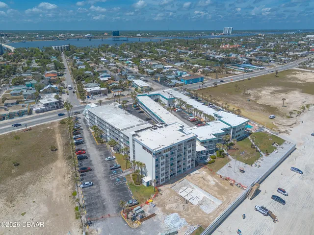 an aerial view of residential houses with outdoor space