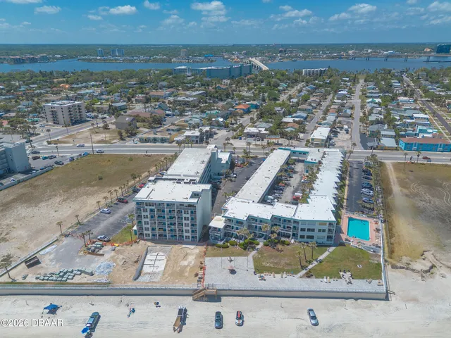 an aerial view of residential houses with outdoor space