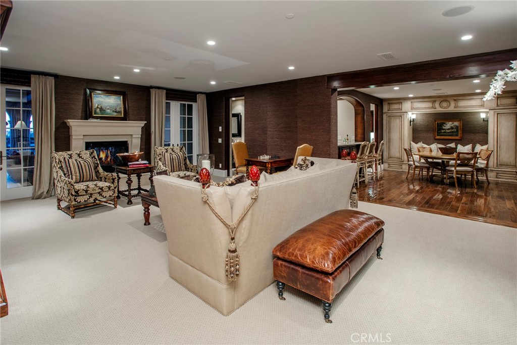 10 Fairway Point Newport Coast, CA 92657 - Photo 25 of 31 a living room with furniture and a fireplace