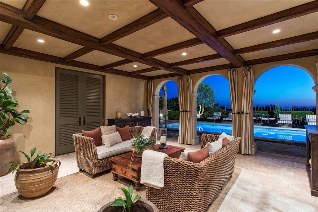 10 Fairway Point Newport Coast, CA 92657 - Photo 26 of 31 a living room with furniture a fireplace and a potted plant