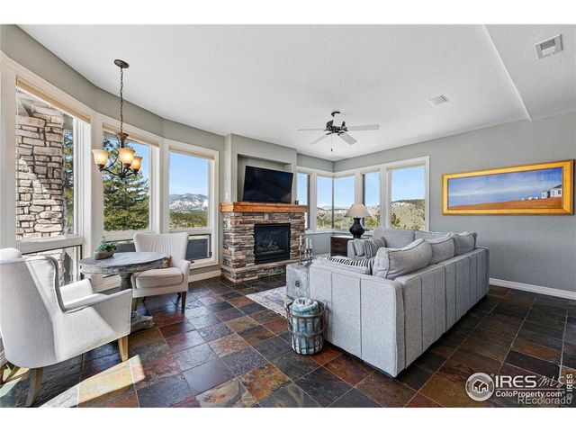 a front view of a house with sitting area