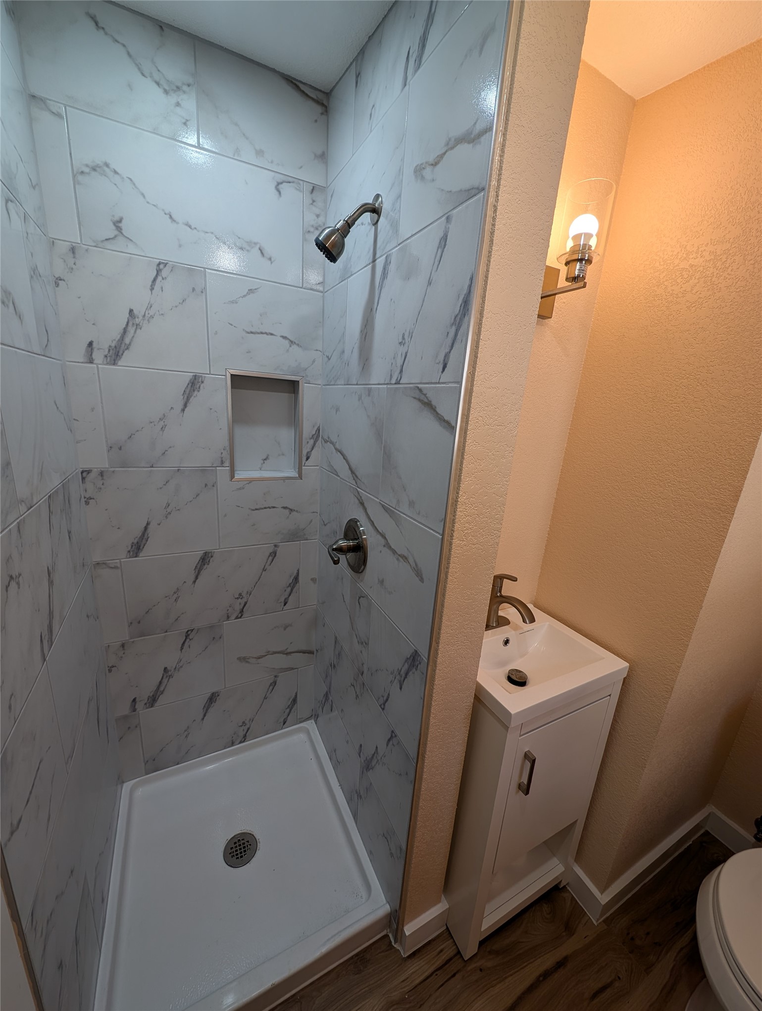 320 Laredo Street Lockhart, TX 78644 - Photo 13 of 27 view of a bathroom with a tub and sink