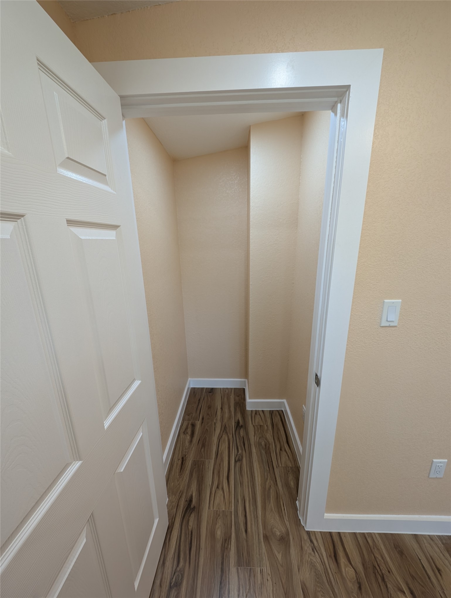 320 Laredo Street Lockhart, TX 78644 - Photo 17 of 27 a view of a room with wooden floor and staircase