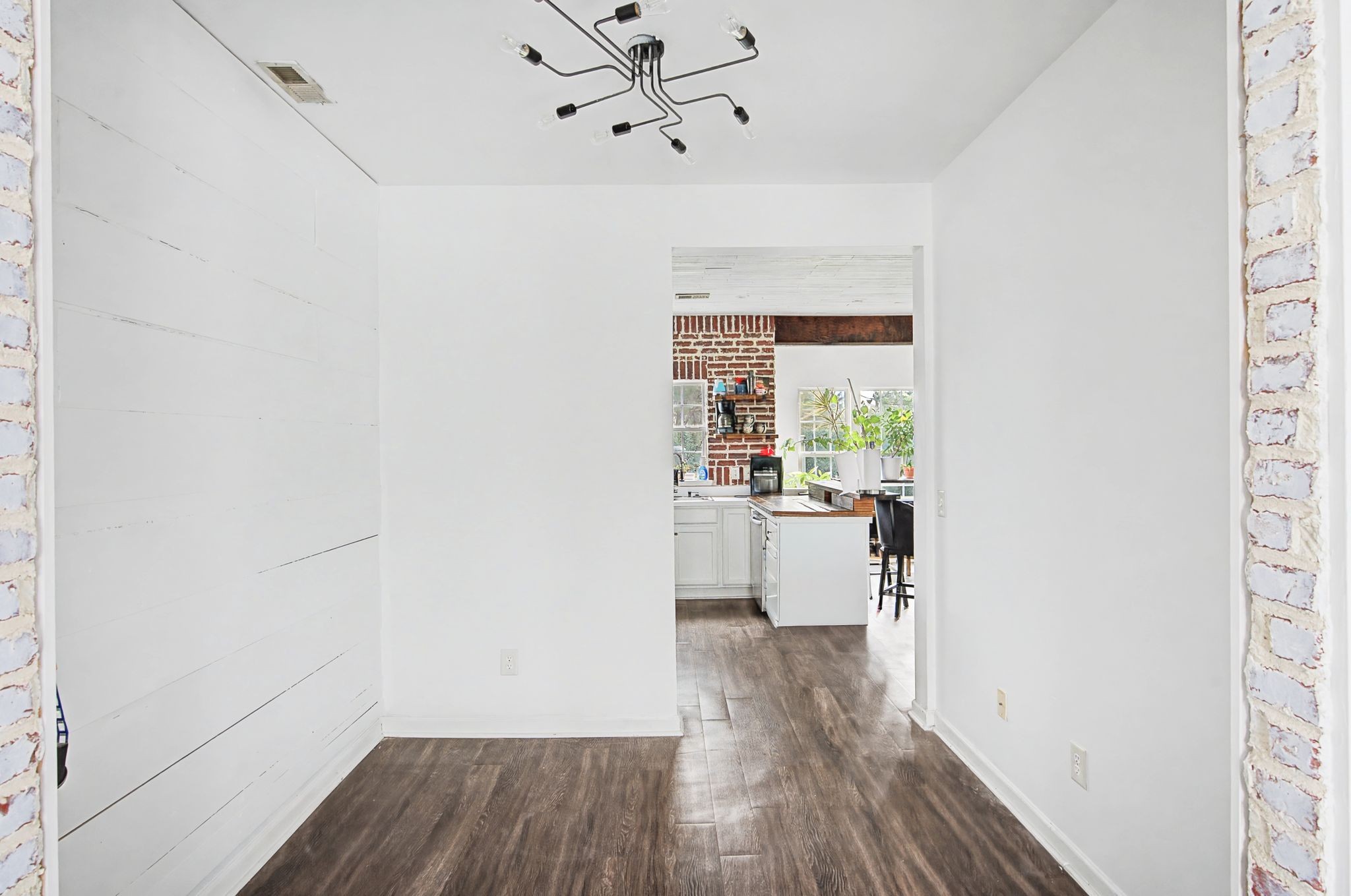 3401 Anderson Road, Unit 4 Antioch, TN 37013 - Photo 16 of 55 a view of a hallway with wooden floor and a kitchen