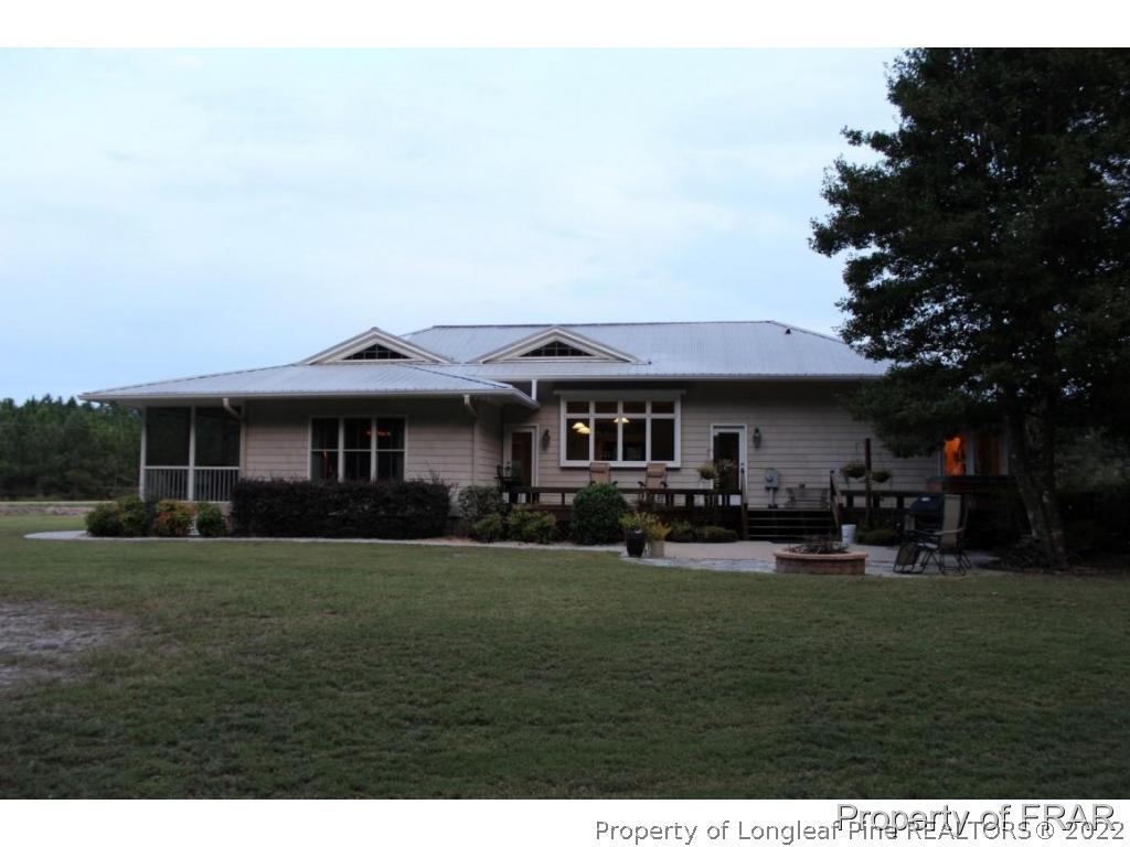 7469 Minnie Hall Road Roseboro, NC 28382 - Photo 27 of 36 a view of a yard in front of the house