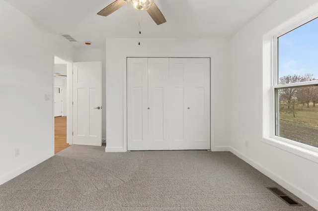 a bathroom with a sink toilet and a mirror