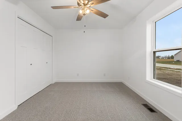 a room with a bench and a window