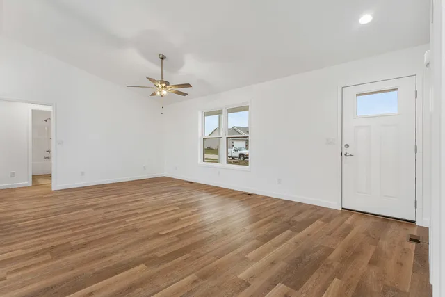 a view of an empty room with a window