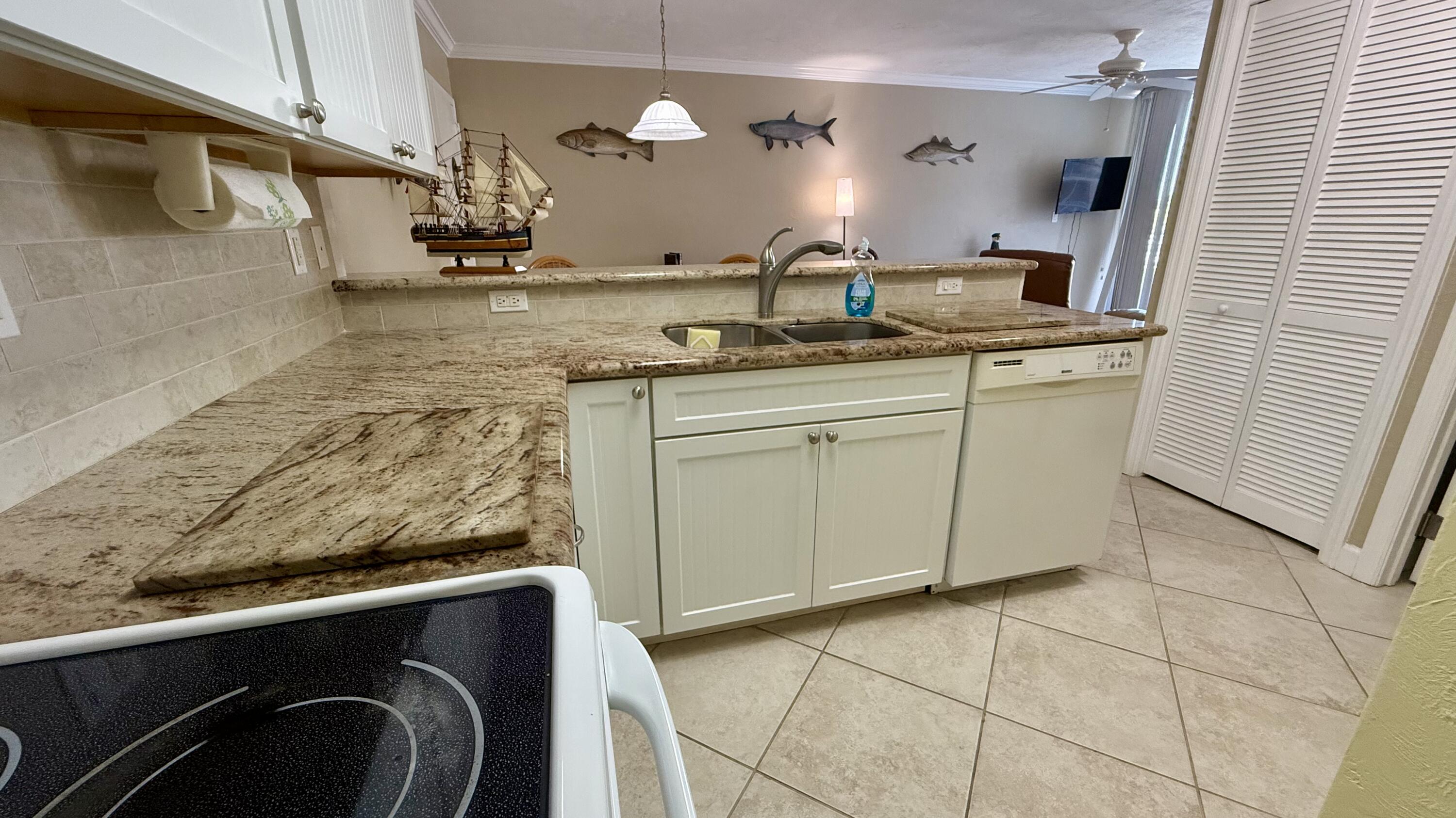 88500 Overseas Highway, Unit 320 Islamorada, FL 33036 - Photo 8 of 30 a bathroom with a sink a vanity and mirror